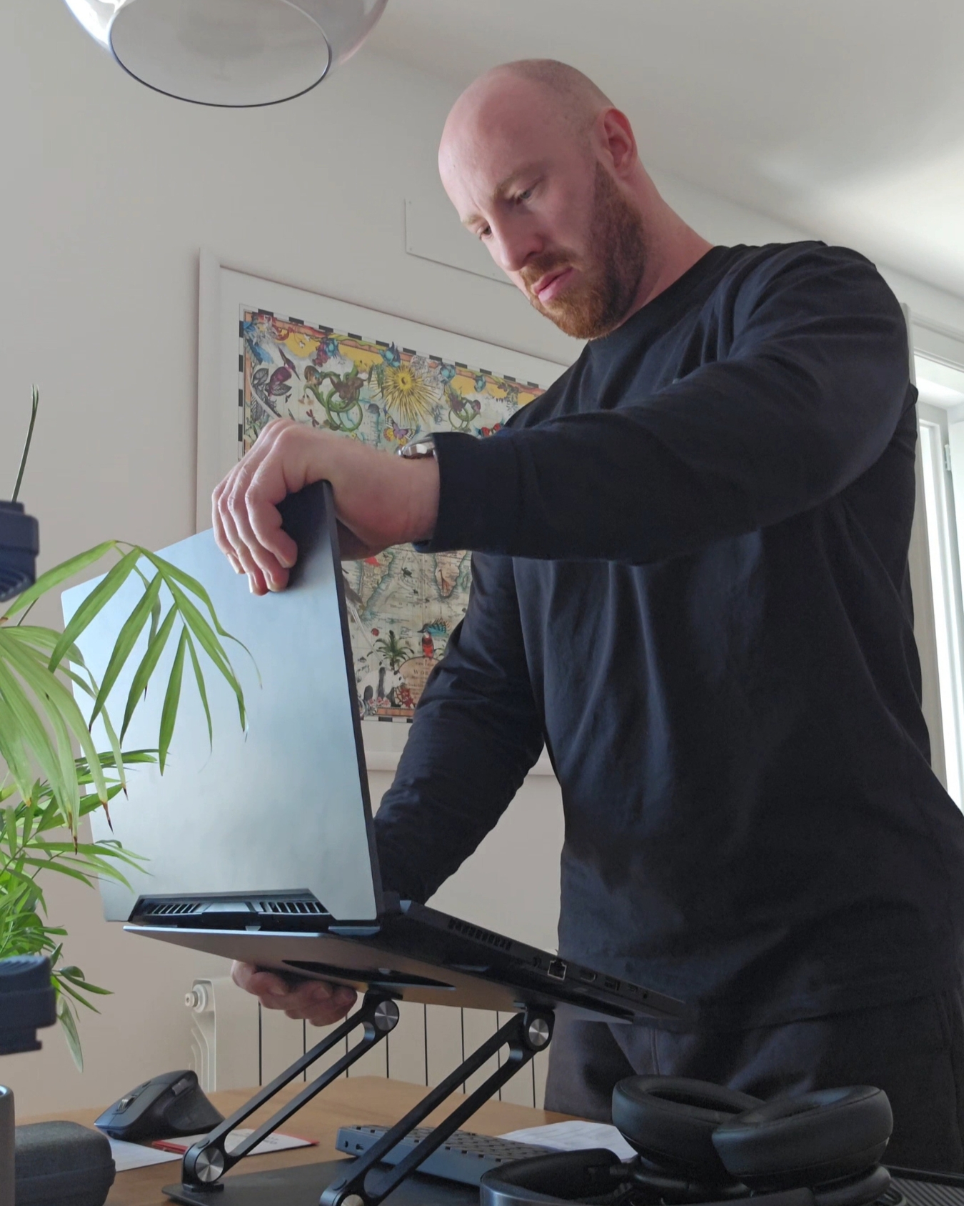 Jacob Parker working at a standing desk with a laptop